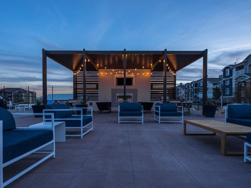 Pool deck at dusk with string lights